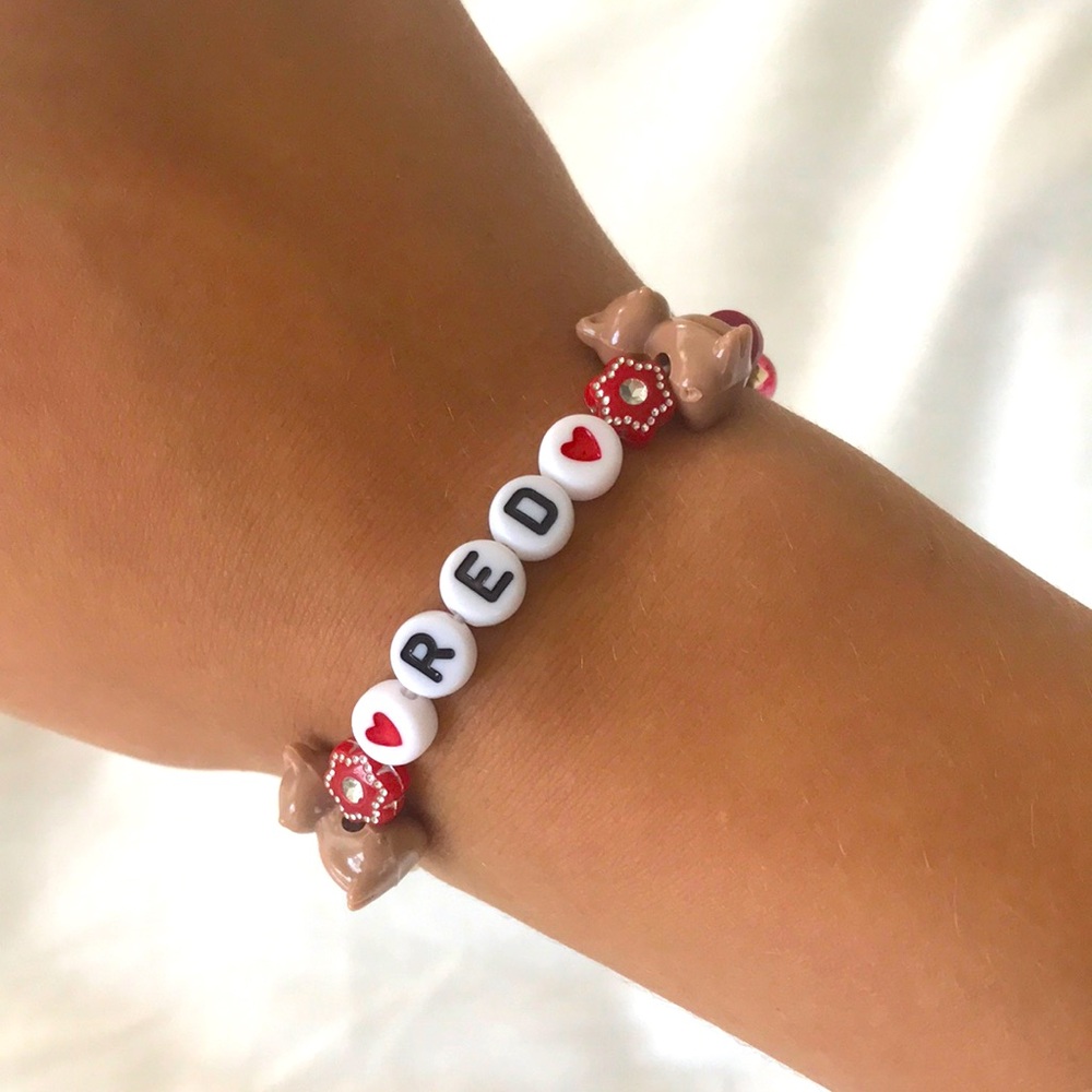 Red and gold Taylor Swift album "Red" Swiftie friendship bracelet.